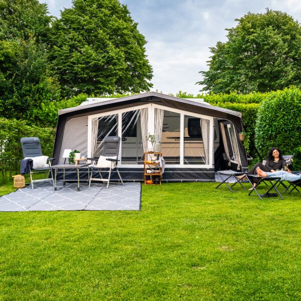 Dorema Diamond XL 270 Caravan Awning being used by a couple in a field