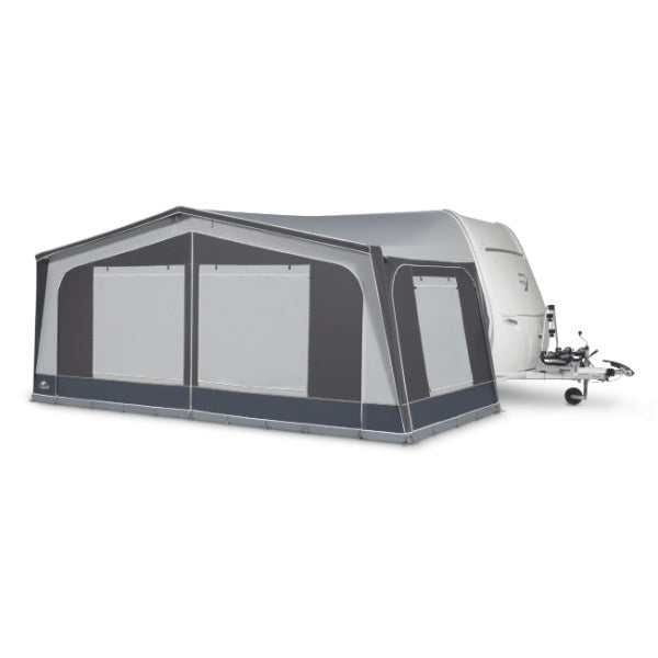 Dorema Monza 240 De Luxe awning with closed blinds attached to a caravan on a white background