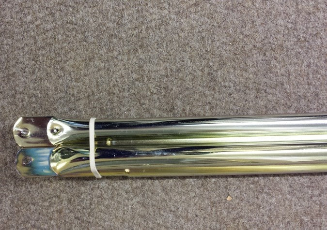 Dorema canopy poles set bundled together on a carpet.