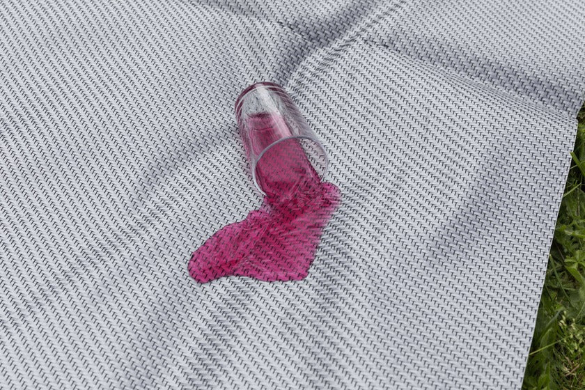 Spilled drink on Dorema Starlon awning carpet demonstrating liquid resistance.