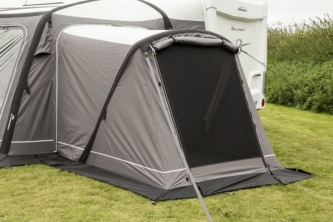 Sunncamp Icon Esteemed Air Annex in grey on a grass field outdoor.