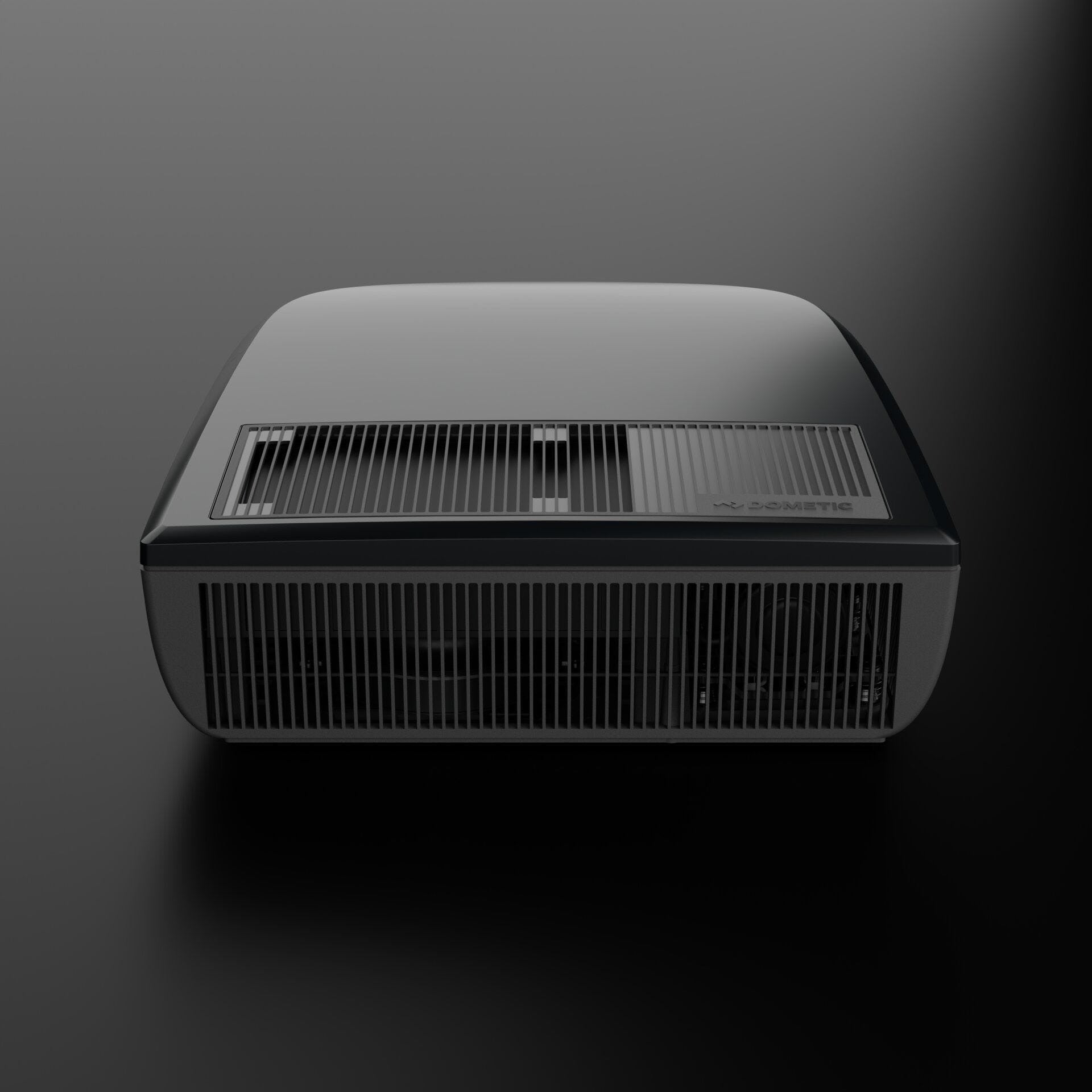 Dometic FJZ7 2200 black campervan roof air conditioner front view with grille detail, on a black background.