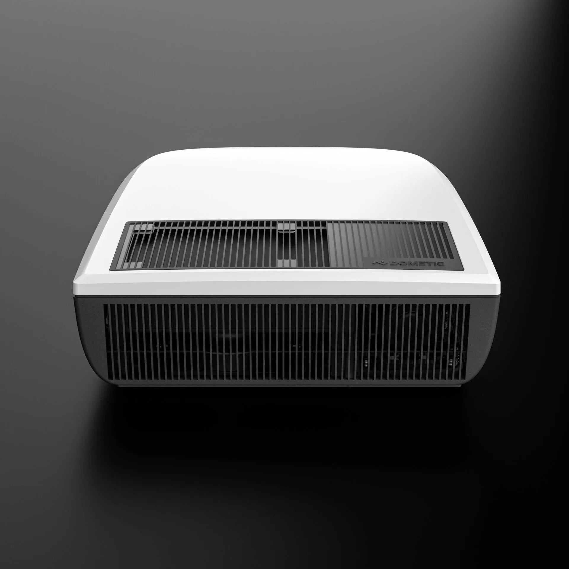 Dometic FJZ7 2600 white campervan roof air conditioner front grille view, on a black background.