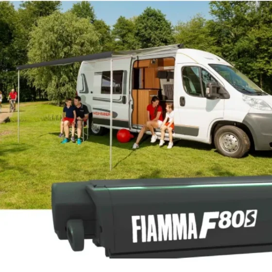 Fiamma F80S awning on a Fiat Ducato with family camping scene outdoors.