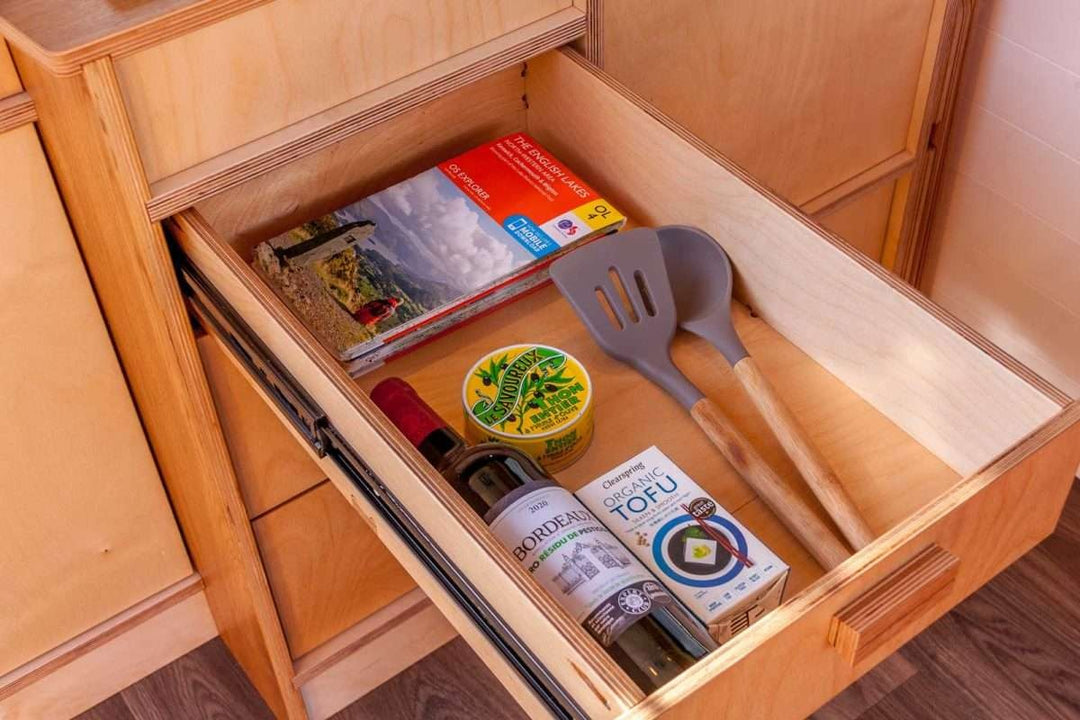 Drawer storage close-up of the Campervan Foss Kitchen Unit showing utensils, food items, and kitchen accessories organised inside.