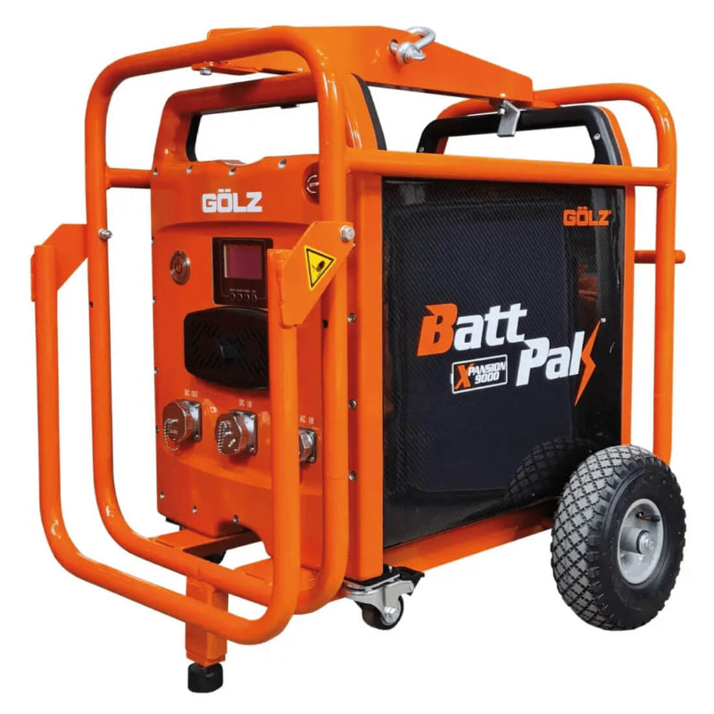  GÖLZ BattPak Xpansion 9000 heavy-duty battery power unit with protective steel frame and wheels for industrial mobility, on a white background.