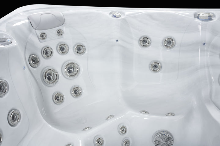 Luso Spas The Hydra Hot Tub interior view showing multiple massage jets and headrest on a black background.