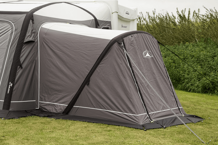 Sunncamp Icon Esteemed Air Annex in grey ooutdoor field.