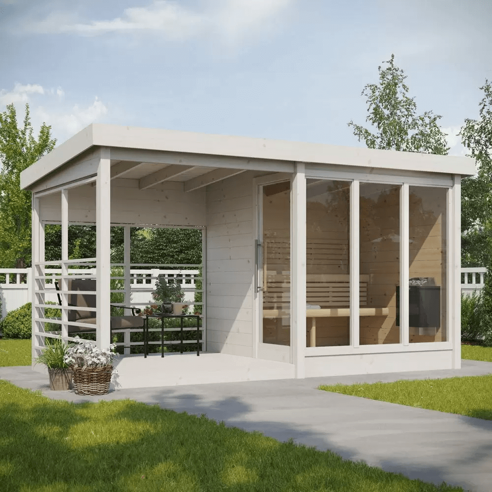 InMedias Anita Log Sauna in white finish in a garden setting.