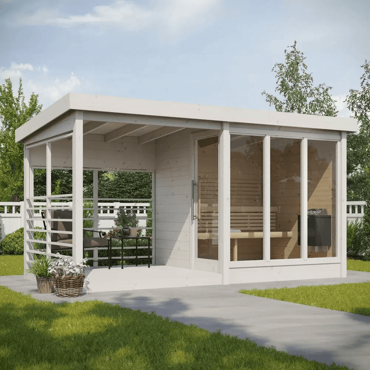 InMedias Anita Log Sauna in white finish in a garden setting.