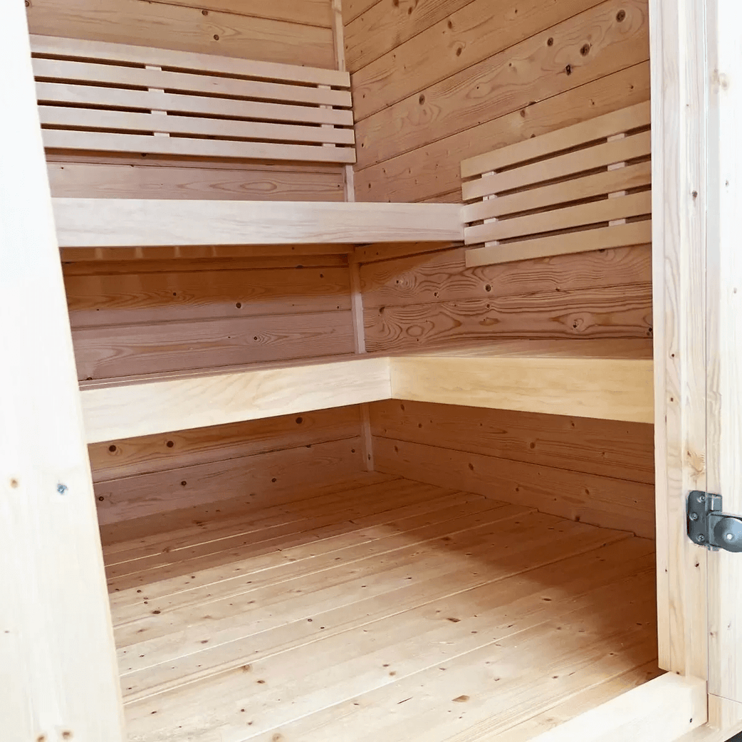 InMedias Brico Log Sauna interior benches on a white background.