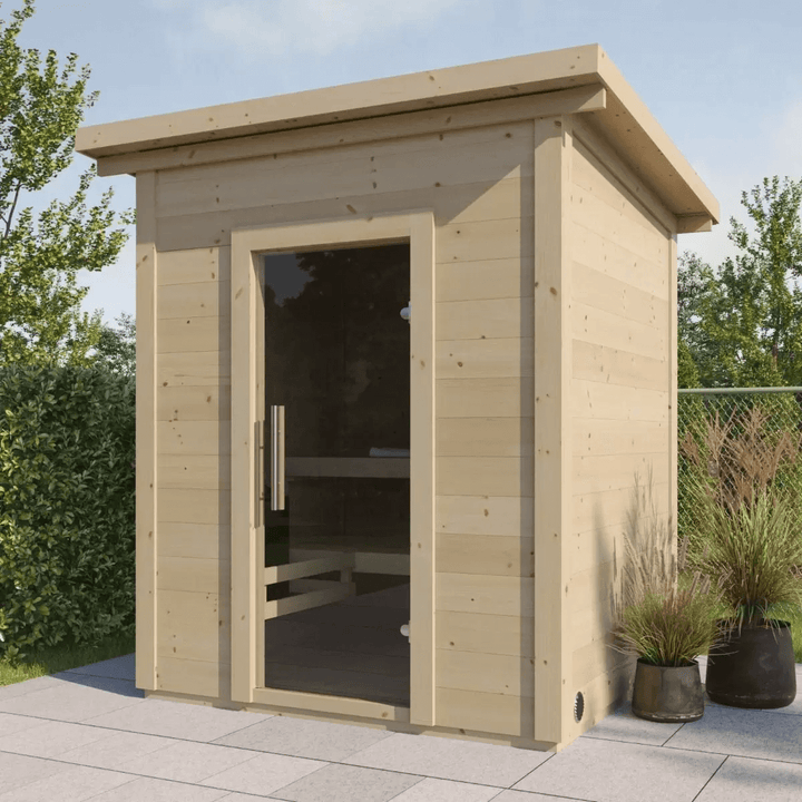 InMedias Brico Log Sauna wooden cabin in an outdoor setting.