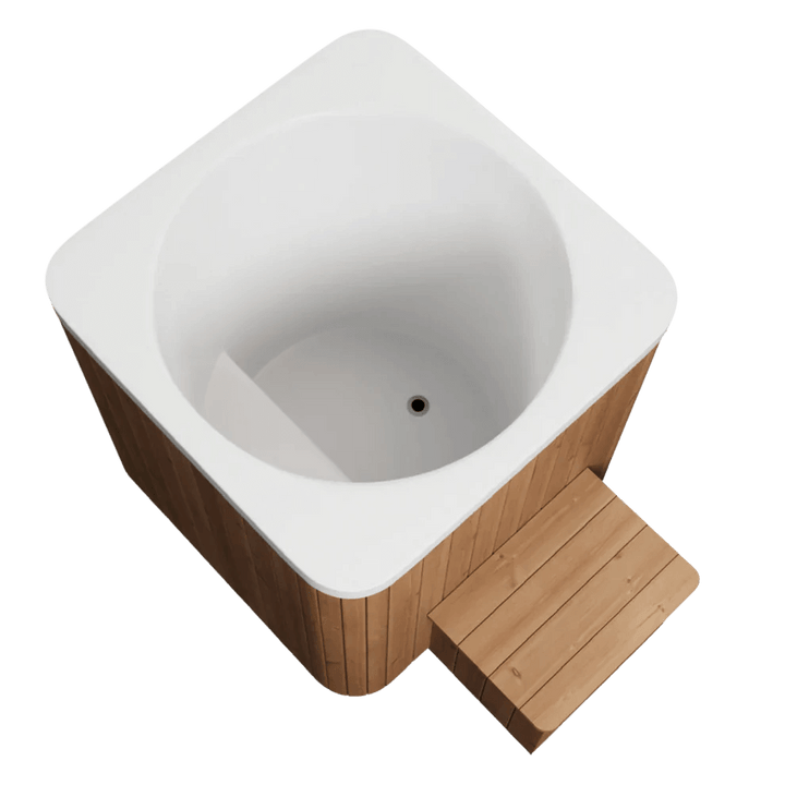 Top-down angled view of square cold plunge tub with white interior and wooden step on a white background