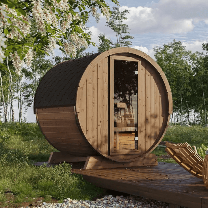 Wooden  InMedias Ergo 180 Barrel Sauna in a deck on a forest setting.