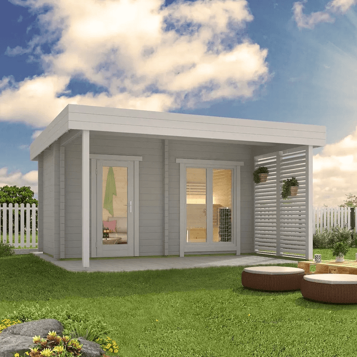 InMedias Magnus Log Sauna in white finish placed in a garden setting.