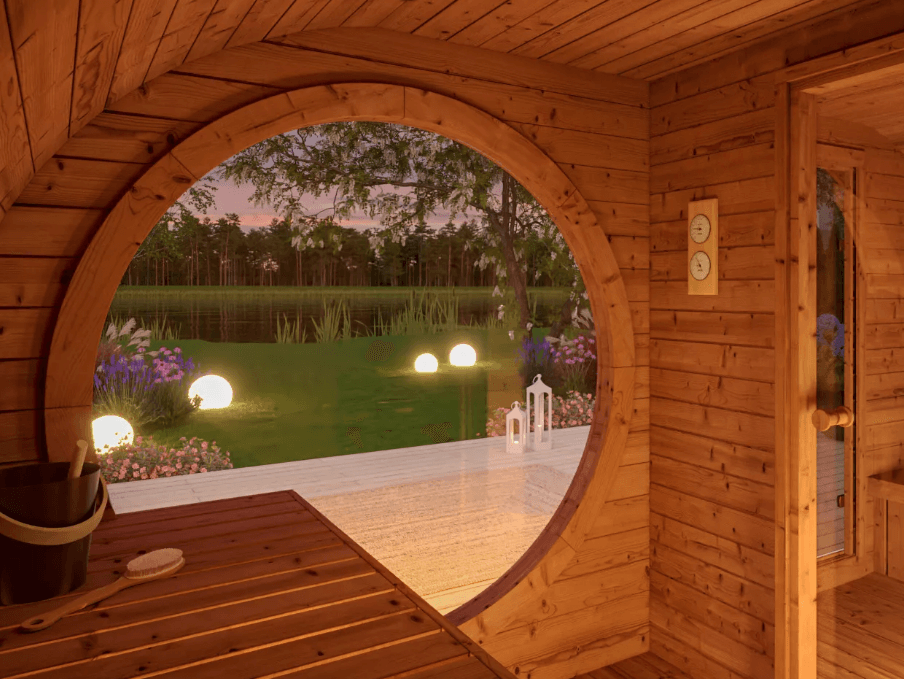 Interior of the InMedias Raiki Oval Sauna with a round window overlooking a garden.