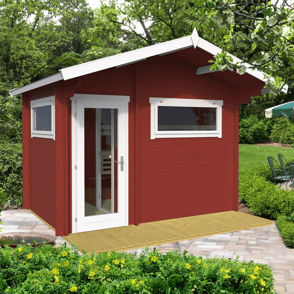 InMedias Timo Log Sauna in red finish with white trim in a garden setting.