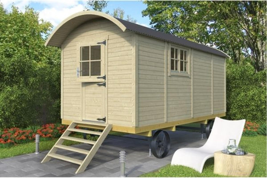 3D rendered image of a beige InMedias Traditional Shepherd Hut with black roof and metal wheels, on a green garden background.