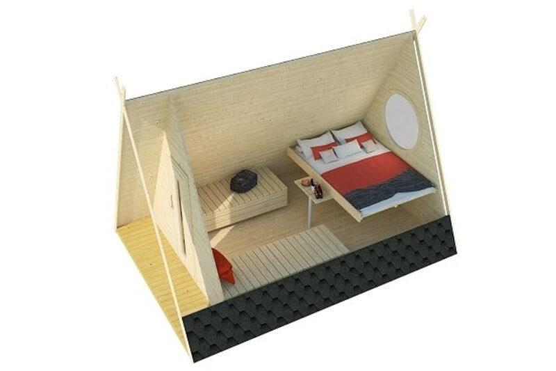InMedias Wigwam Glamping Pod – interior cutaway view of an A-frame cabin showing a double bed with red and white bedding, a round window, and built-in wooden bench and table, on a white background.