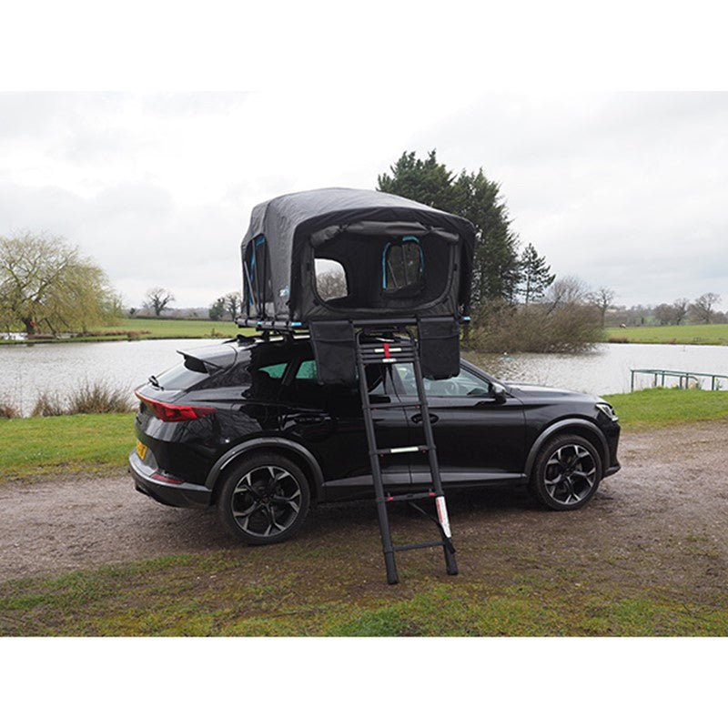 Skypod Lite rooftop tent with aerodynamic design set up on a modern SUV for car camping.
