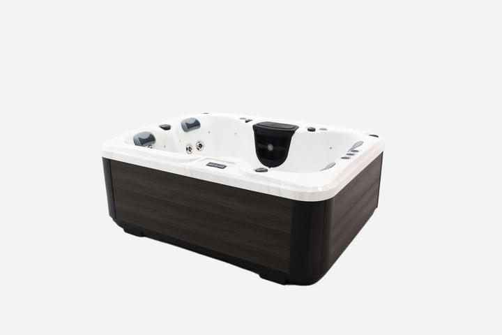Angled side view of Luso Spas The Eden Hot Tub in white acrylic with dark wood-effect exterior panels on a white background.