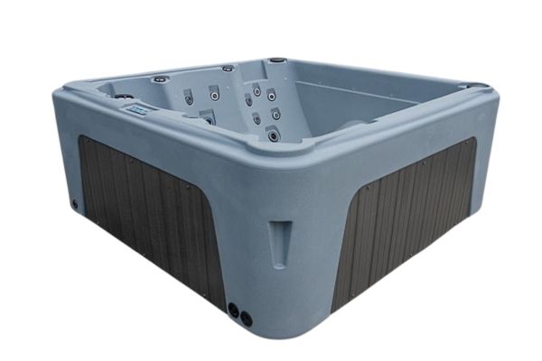 Angled side view of Luso Spas The Rota Laguna Hot Tub in light grey finish with dark grey exterior panels on a white background.