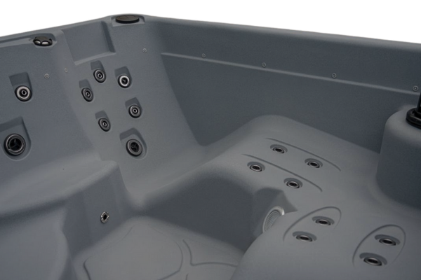 Close-up interior shot of Luso Spas The Rota Laguna Hot Tub in grey showing ergonomic contours and jet placement.