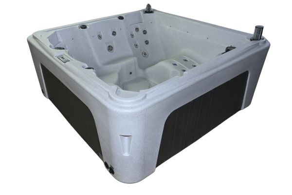 Side angle view of Luso Spas The Rota Laguna Hot Tub in white granite finish with dark exterior panels on a white background.
