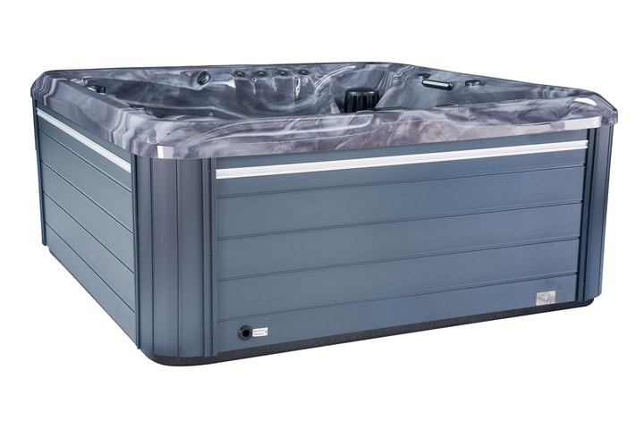 Angled view of Luso Spas The 7000 Hot Tub exterior in grey with dark marble-effect shell on a white background.