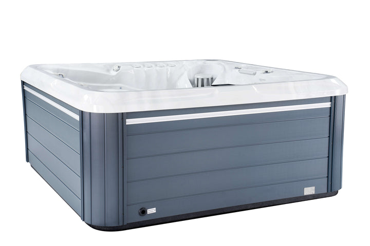 Side view of Luso Spas The 7000 Hot Tub featuring grey wood-effect exterior panels and white acrylic shell on a white background.