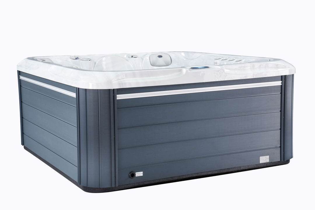Angled side view of Luso Spas The Aquarius Plug & Play Hot Tub in white acrylic with grey wood-effect exterior panels on a white background.