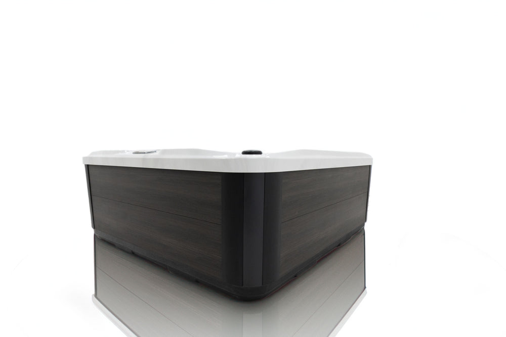 Side view of Luso Spas The Garda Hot Tub exterior showing modern dark wood-effect panel design on a white background.