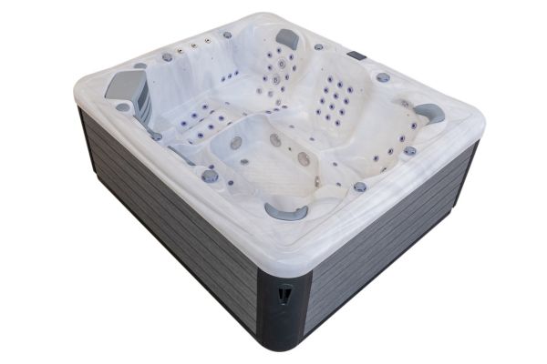 Angled side view of the Luso Spas The Maximus 2 Hot Tub in white with grey wood-style panels, on a white background.