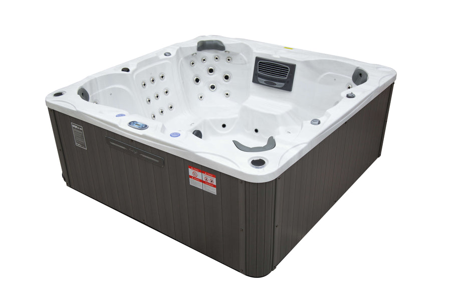 Rear angled view of the Luso Spas Miami Hot Tub with control panel and drink holders visible, on a white background.