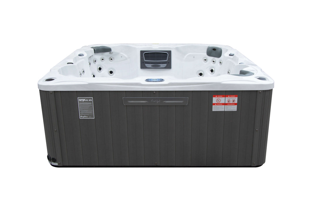 Front view of the Luso Spas Miami Hot Tub with closed cabinet and warning labels visible, on a white background.