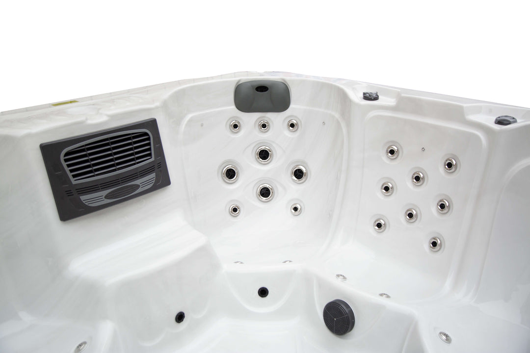 Close-up interior view of corner seat in the Luso Spas Miami Hot Tub showing hydrotherapy jets and headrest, on a white background.