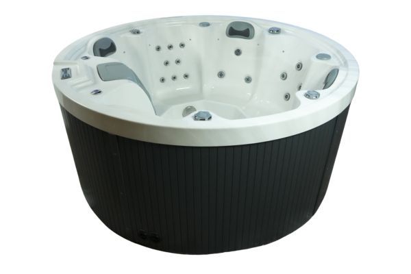 Side exterior view of Luso Spas The Orb Hot Tub in white acrylic finish and grey wood-effect base, highlighting circular build and controls, on a white background.