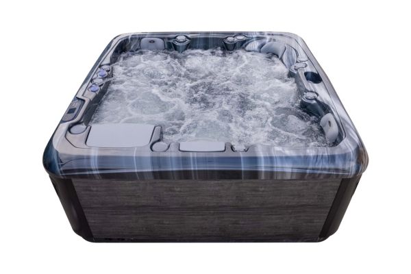 Front view of Luso Spas The Platinum 4 Hot Tub filled with bubbling water, on a white background.