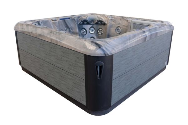 Corner angle exterior view of Luso Spas The Platinum 5 Hot Tub in Odyssey Grey with wood-effect paneling, on a white background.