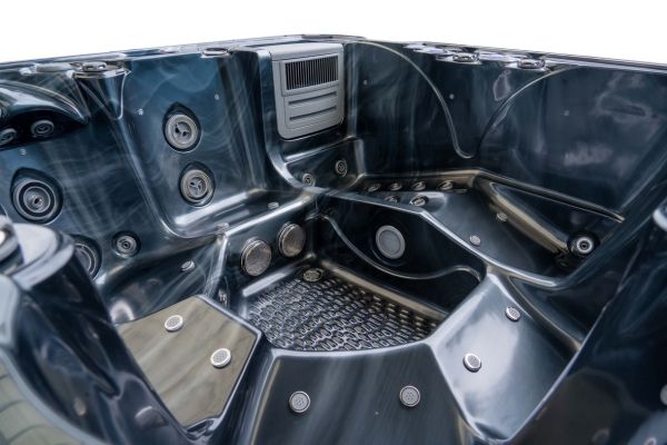 Angled view of the black acrylic Luso Spas The Platinum 5 Hot Tub showing various jet placements.