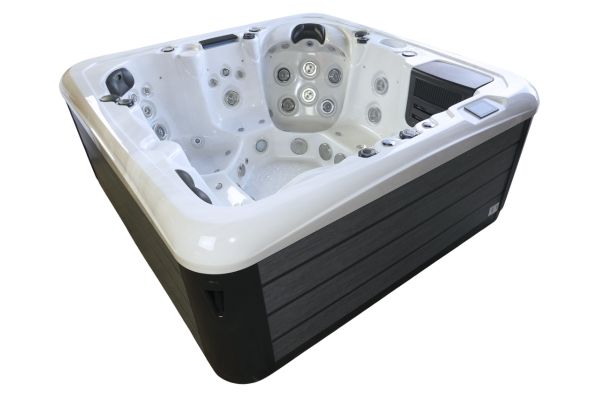 Angled exterior view of Luso Spas The Platinum 7 Hot Tub in white acrylic with dark side panels, on a white background.