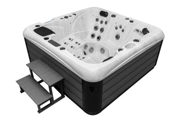 Angled side view of Luso Spas The Platinum 4 Hot Tub in white acrylic with side steps and wood-effect panels, on a white background.
