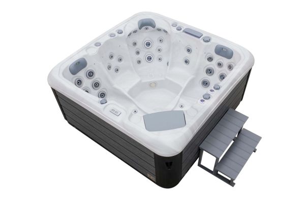 Luso Spas The Platinum 3 Hot Tub in white acrylic finish with steps, angled view, on a white background.