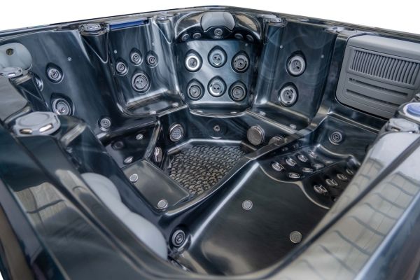 Black acrylic interior of Luso Spas The Platinum 5 Hot Tub with multiple jets.