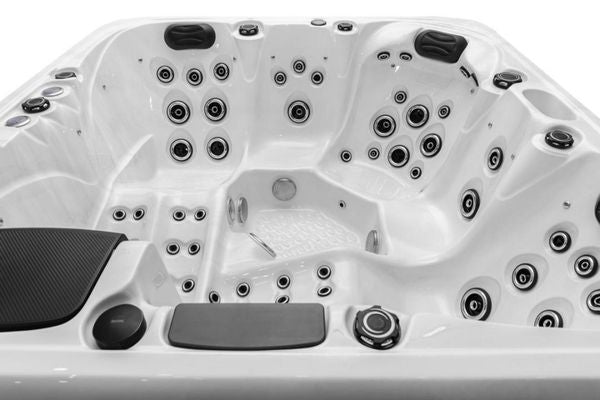 Interior view of Luso Spas The Platinum 4 Hot Tub in white acrylic finish with black accents, on a white background.