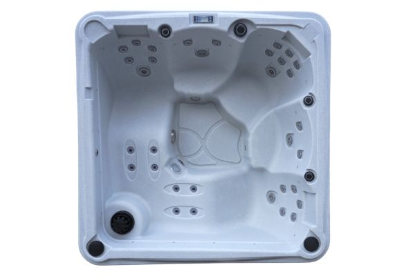 Top-down view of Luso Spas The Rota Laguna Hot Tub in white granite finish highlighting ergonomic seats and central footwell on a white background.

