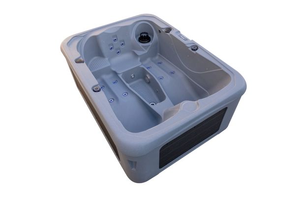 Side angle of Luso Spas The Rota Triad Hot Tub in light grey finish with ergonomic lounger seats and hydrotherapy jets on a white background.