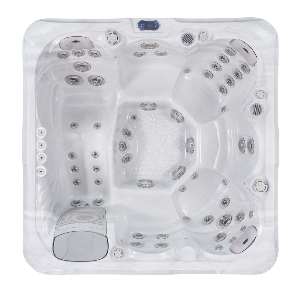 Top-down view of Luso Spas The Vela Hot Tub in white acrylic finish highlighting ergonomic seating and full-body jet placement on a white background.
