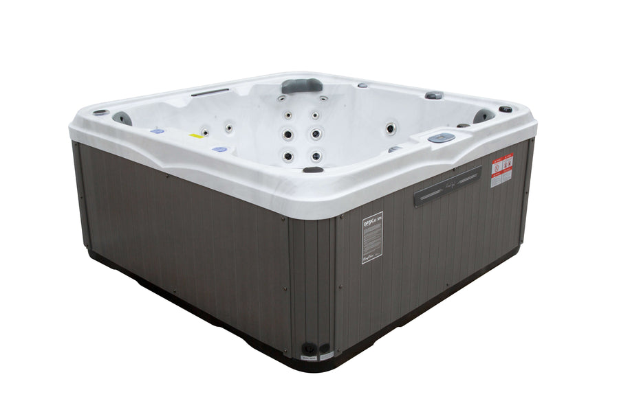 Angled side view of Luso Spas The Venice Hot Tub in white and grey design showing ergonomic seats and exterior paneling, on a white background.