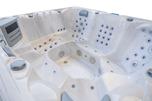Close-up angled interior of the Luso Spas The Maximus 2 Hot Tub in white, on a white background.